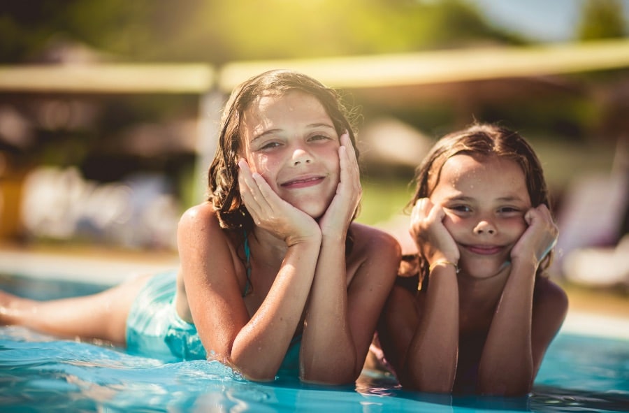 Young girls enjoying a pool